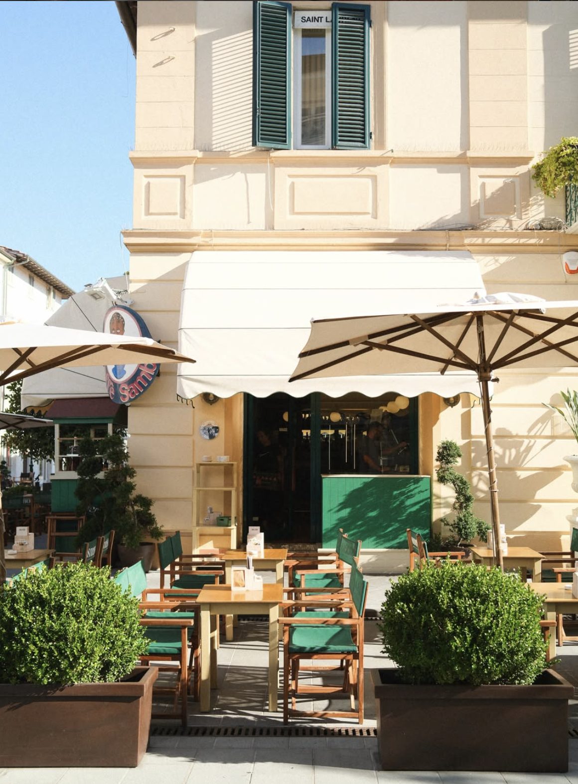 The white awning and outside tables of Caffè Sambo in Forte dei Marmi.