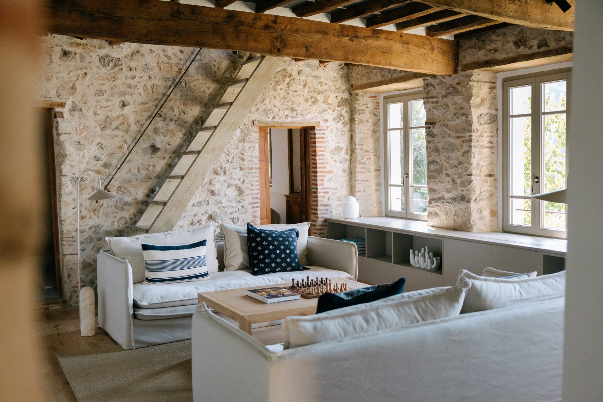 Stone walls and deep-set windows retained in the living room