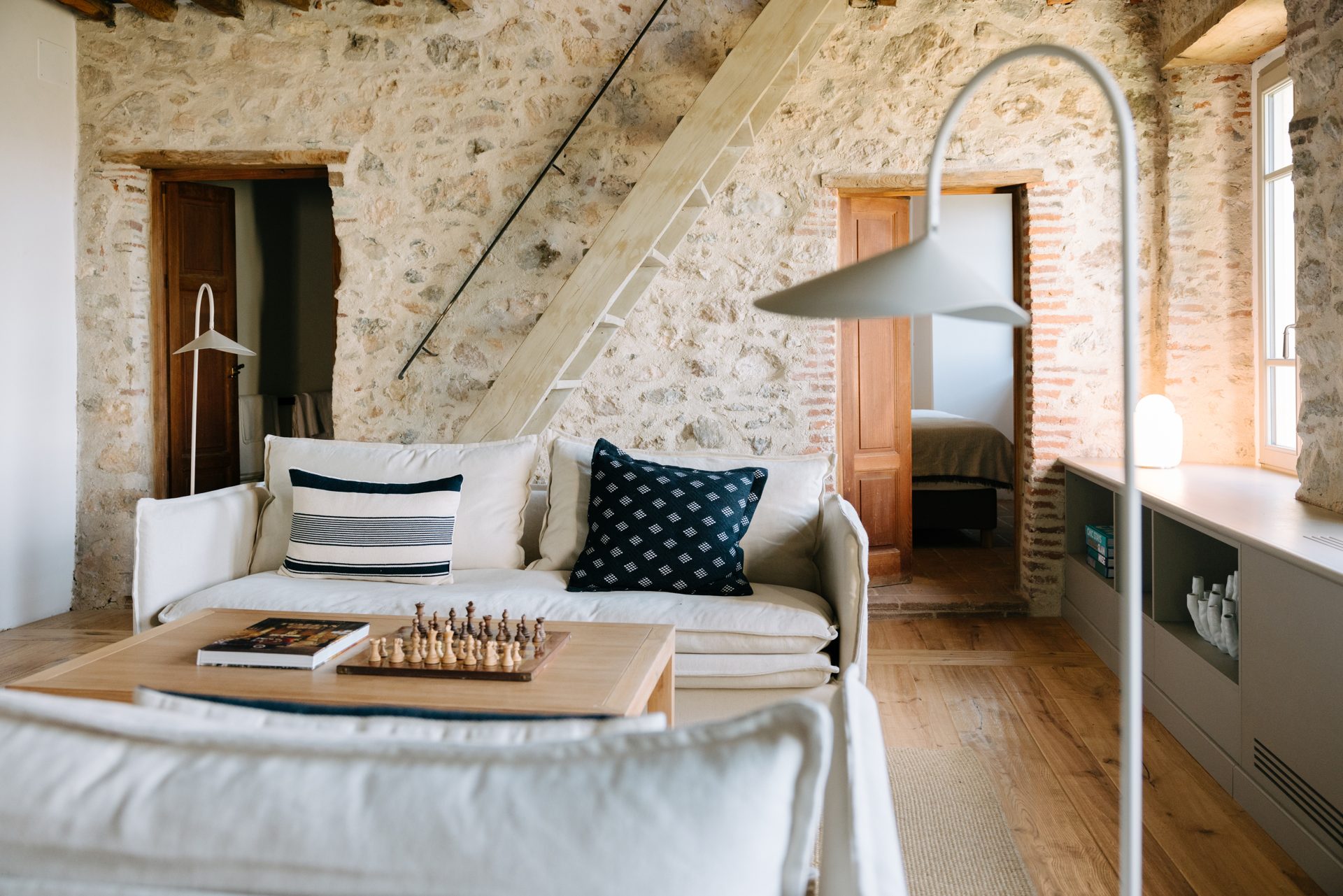 Living room of Metato House with original timber beams